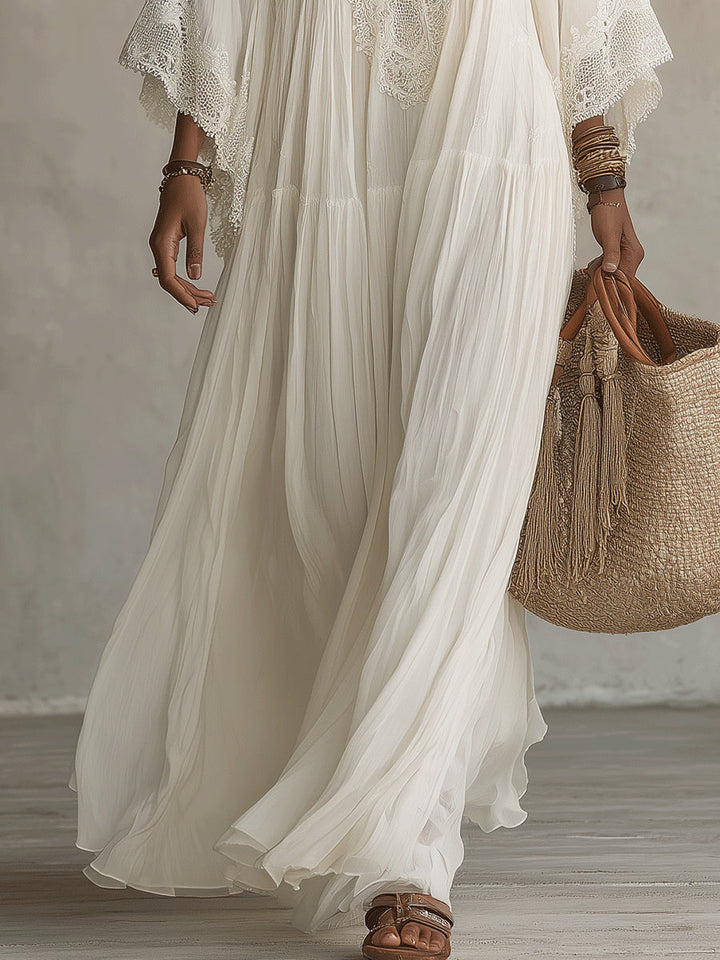 Robe longue d'été femme bohème chic, légère et fluide. Détails dentelle, idéale pour la plage ou les journées décontractées.