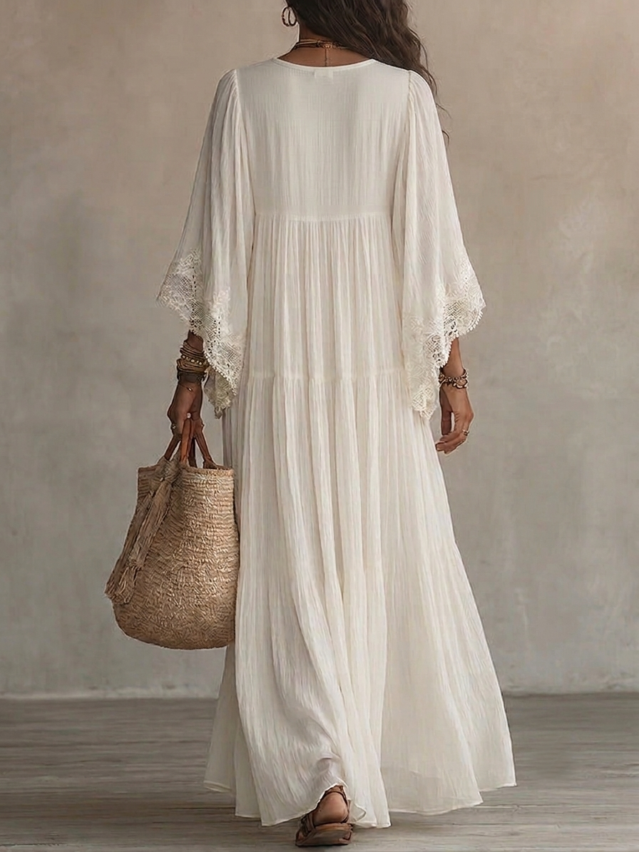 Robe maxi femme élégante style bohème, parfaite pour la plage ou vacances d'été. Coupe fluide et décontractée.