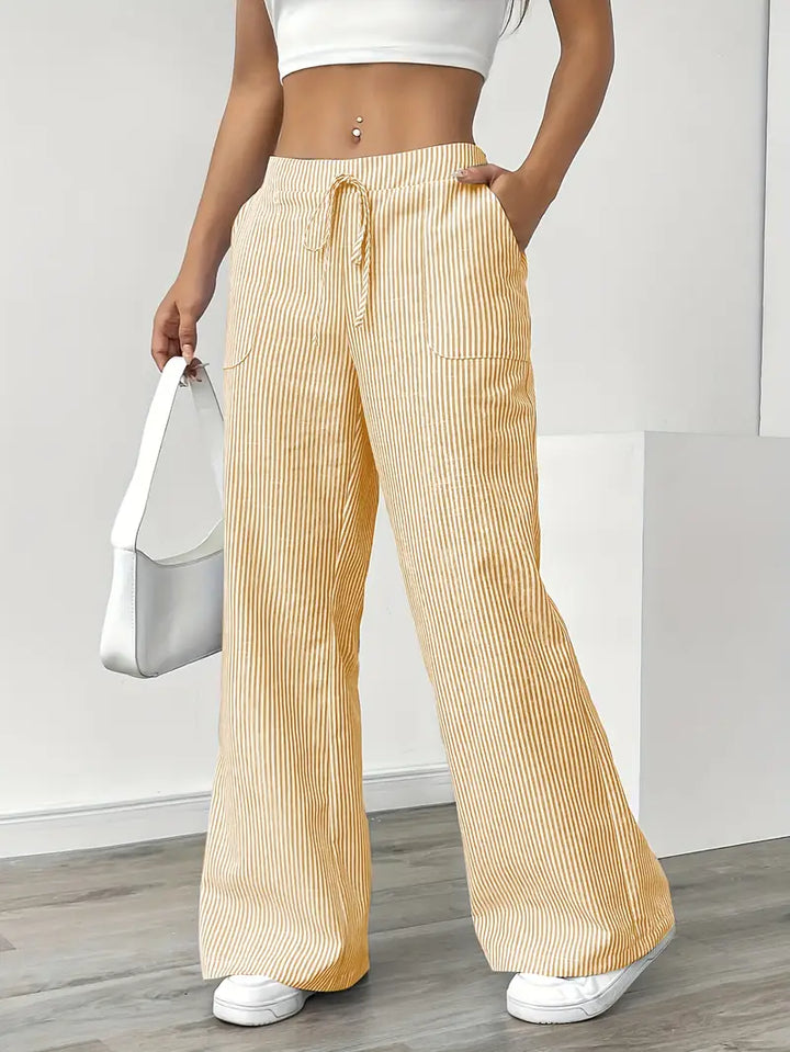 Pantalon femme rayé, élégant, avec poches, idéal pour la mode.