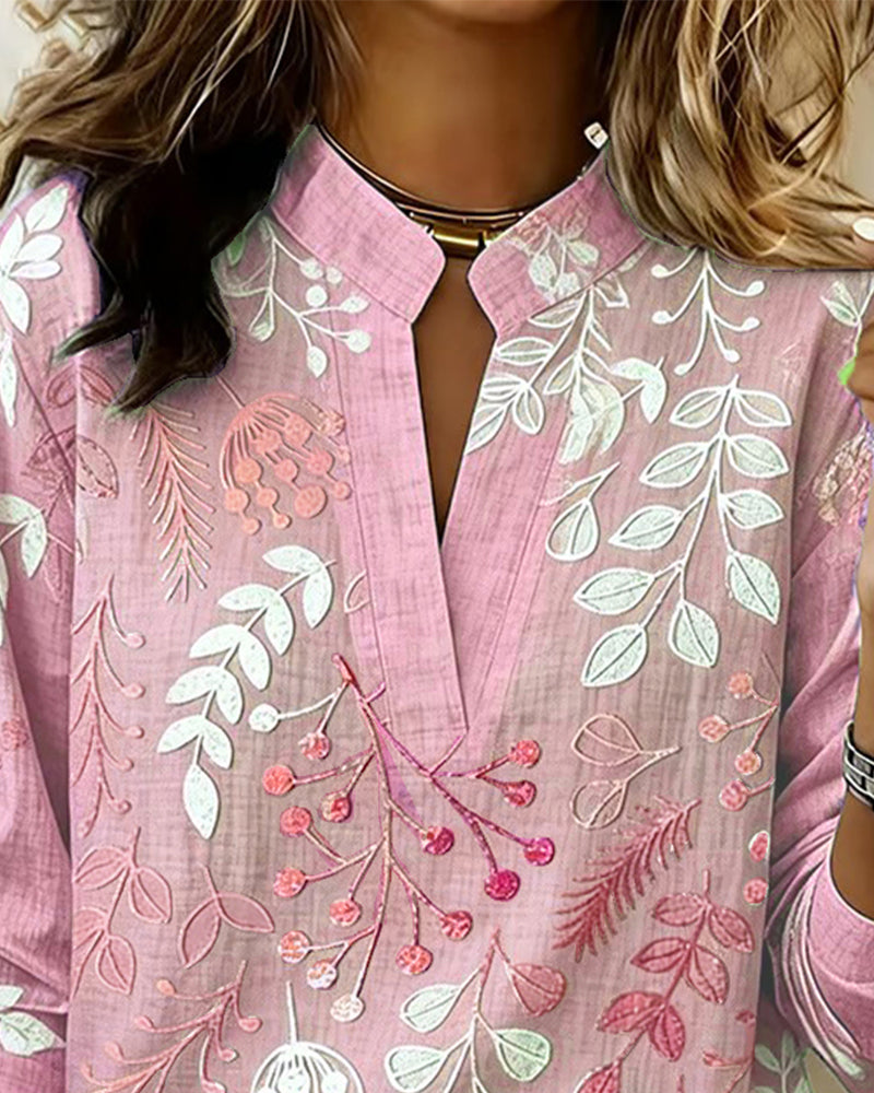 Haut femme élégant, floral, col V, coupe fluide, manches longues, pour un style chic et quotidien.