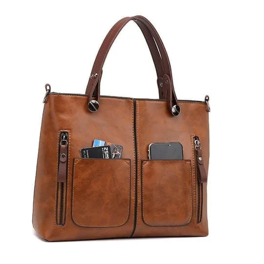 Sac de voyage femme en cuir PU noir, robuste et élégant, compagnon idéal pour l'aventure urbaine.
