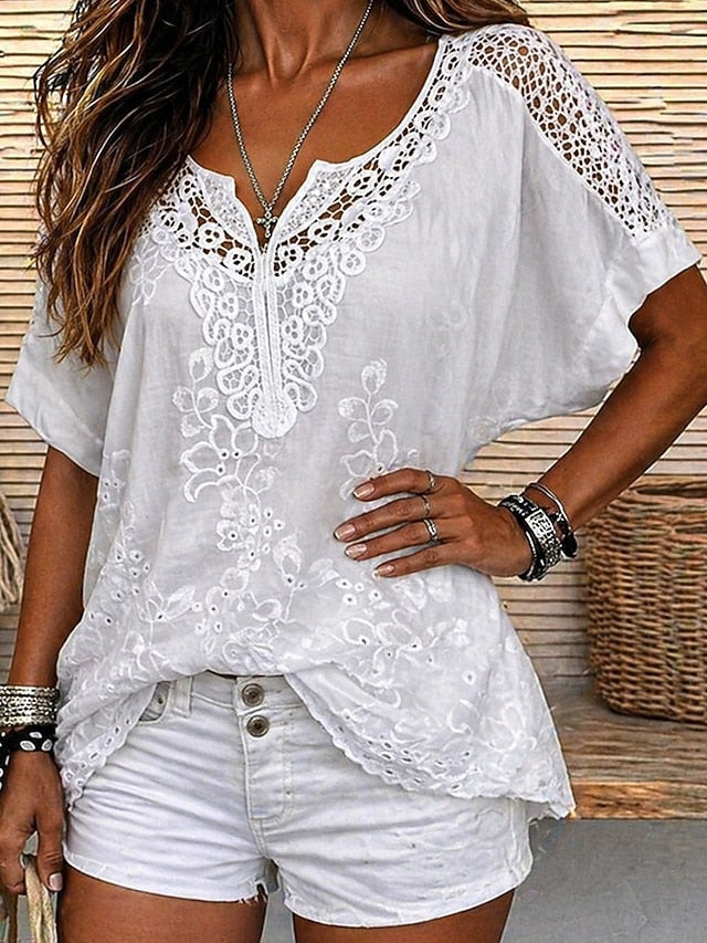 Blouse femme brodée florale fluide, coupe élégante pour l'été. Confort quotidien assuré.