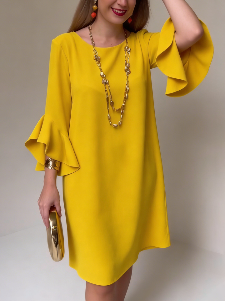 Robe fluide élégante femme à manches volantées, parfaite pour l'été et le printemps. Style chic et décontracté.