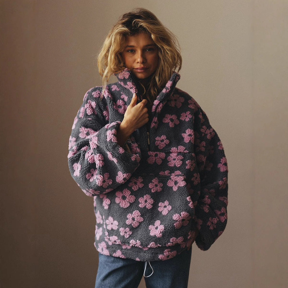 Pull zippé femme coupe ample avec poches, manches longues, couleur unie. Confort quotidien.