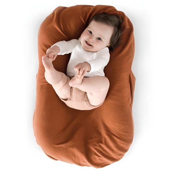 Nid de bébé en coton pour nouveau-né, assurant un repos confortable et sécurisé.