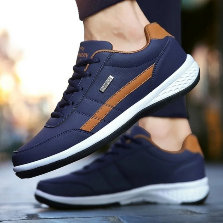 Profil latéral de baskets homme blanches, offrant un design élégant et un confort supérieur pour un usage quotidien.