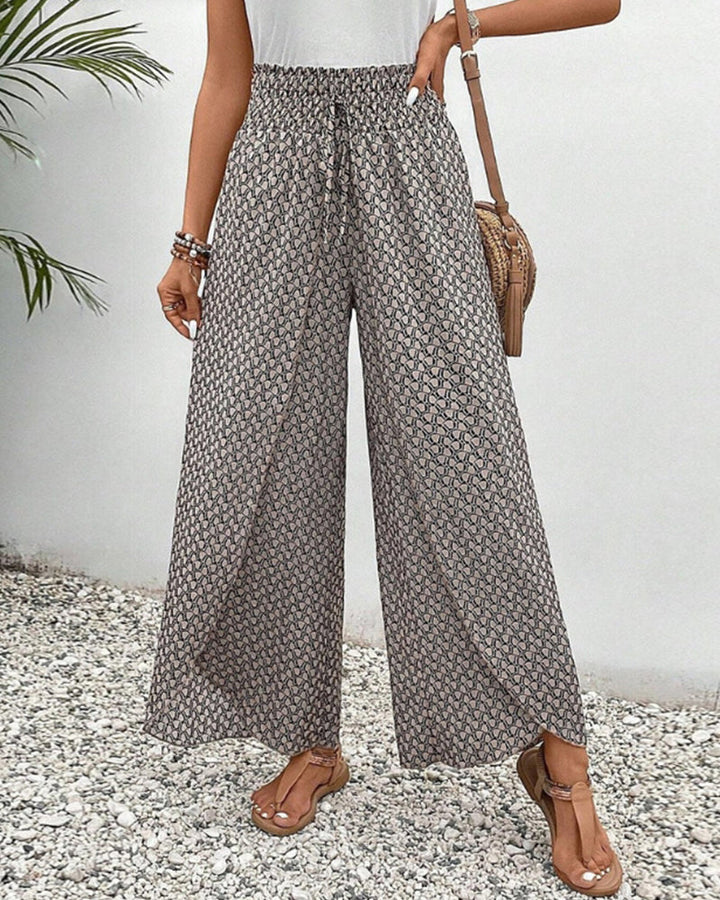 Pantalon large taille haute femme, élégant et confortable, idéal pour mode printemps-été.