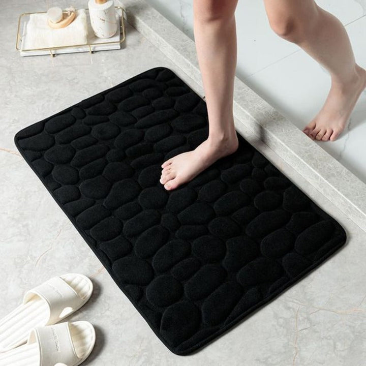 Tapis de salle de bain robuste en mousse mémoire, design pierre, facile à nettoyer, hygiène assurée.