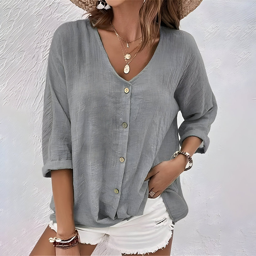 Blouse femme élégante à col V, manches courtes. Style décontracté chic pour un confort quotidien et mode.