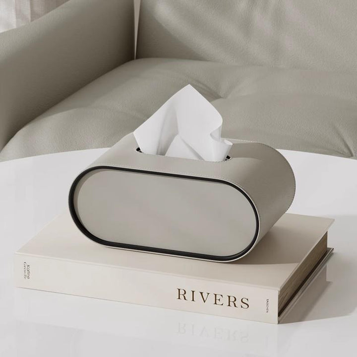 Boîte à mouchoirs ovale design pour bureau et salon, disponible en couleurs élégantes. Rangement chic.
