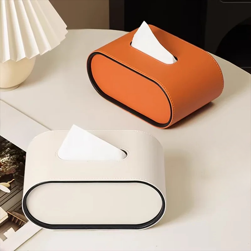 Organisateur de mouchoirs ovale chic, alliant design et fonctionnalité pour un bureau ou salon moderne.