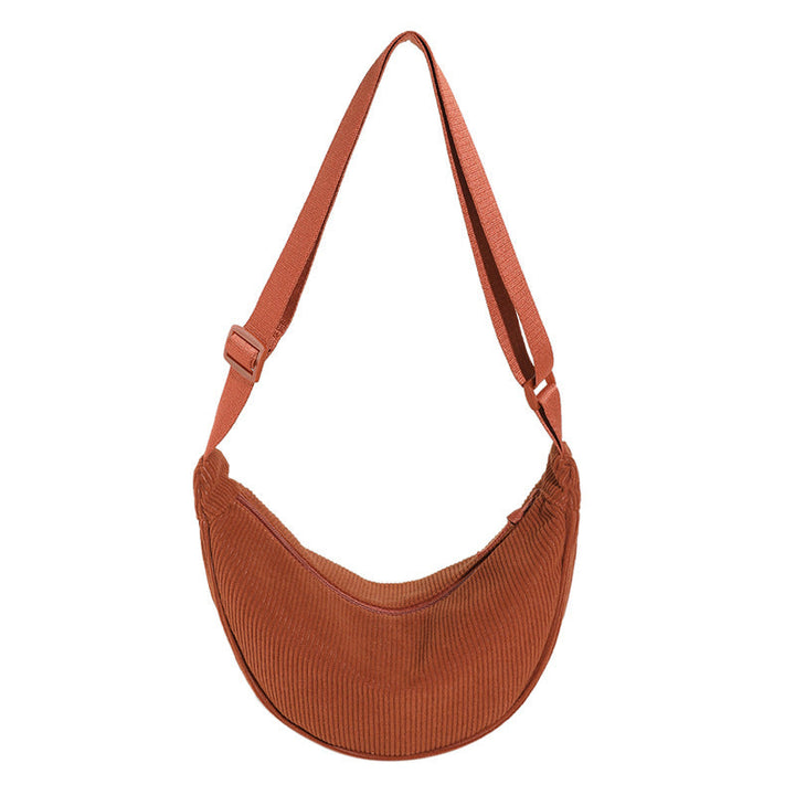 Sac femme à bandoulière, design demi-lune texturé, parfait pour une touche mode et chic au quotidien.