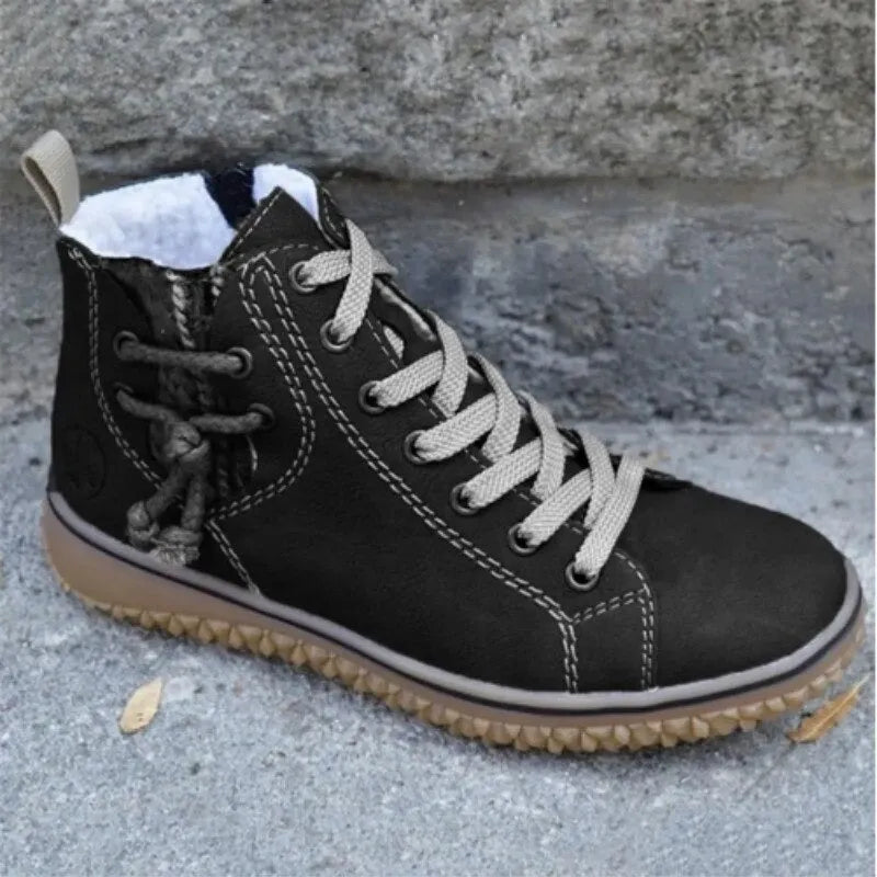 Bottines mode femme en similicuir avec doublure fourrée, lacets et zip, parfaites pour l'hiver.