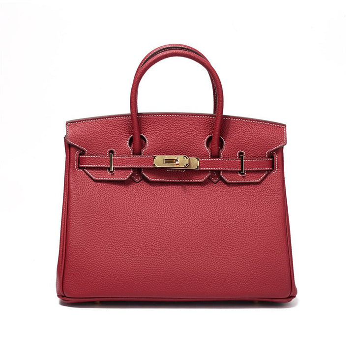 Sac à main en cuir, avec bandoulière amovible, polyvalent et fonctionnel.