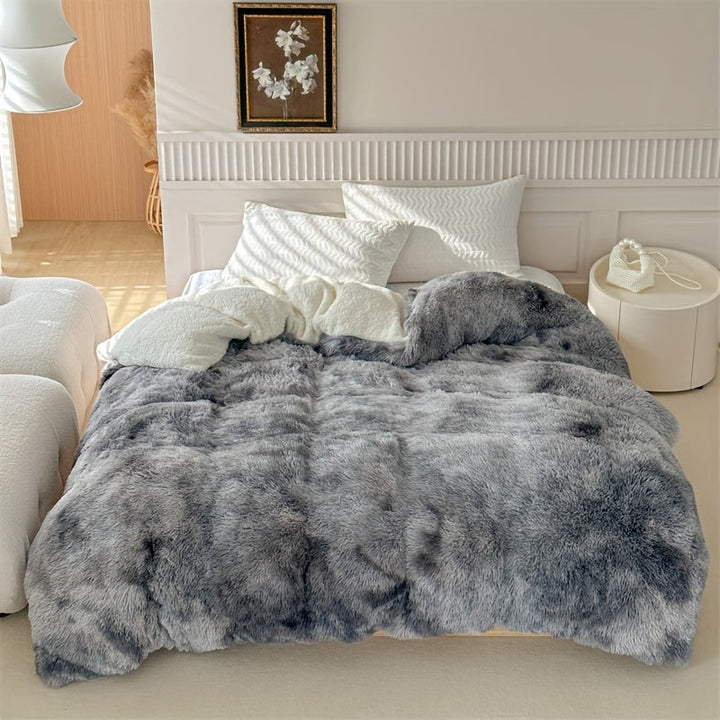 Plaid polaire luxueux offrant une chaleur douillette et un toucher peau de mouton incomparable.