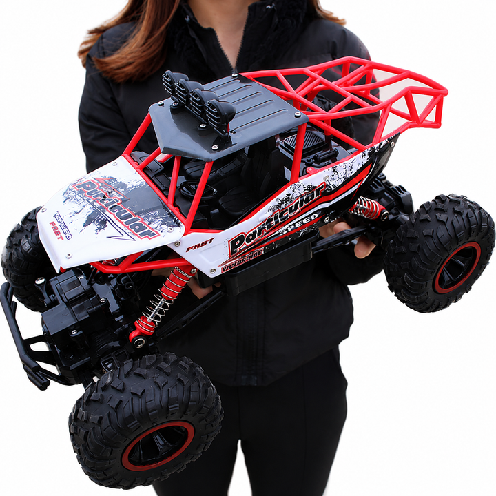 Le monster truck télécommandé 4x4 passe sur des rochers, véhicule RC robuste pour loisirs.