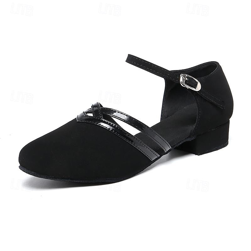 Paire de chaussures de danse noires pour femmes, talon bas confortable, idéales pour la pratique et les soirées.