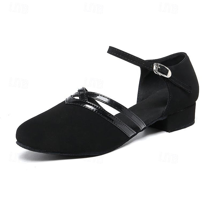 Paire de chaussures de danse noires pour femmes, talon bas confortable, idéales pour la pratique et les soirées.