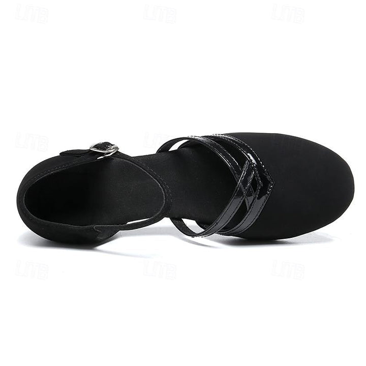 Chaussures de danse femme à talon bas, en noir, conçues pour le confort et la performance sur piste.