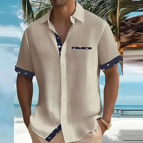 Chemise homme respirante à col cubain, manches courtes, finitions contrastées pour look estival élégant.