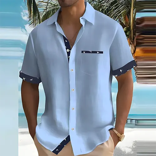 Chemise homme estivale à col cubain et manches courtes, tissu respirant, détails contrastés. Mode masculine.