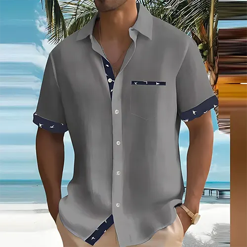 Chemise homme respirante pour l'été, col cubain, manches courtes, finitions contrastées, style décontracté chic.
