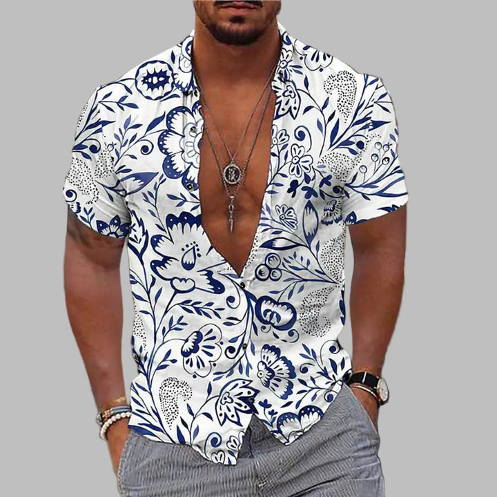 Chemise homme imprimée estivale, motif audacieux, coupe décontractée pour confort et style plage. Mode été légère.