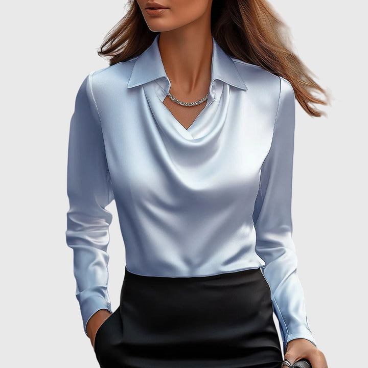 Blouse femme élégante à manches longues, coupe fluide, parfaite pour un look sophistiqué au bureau ou en soirée.