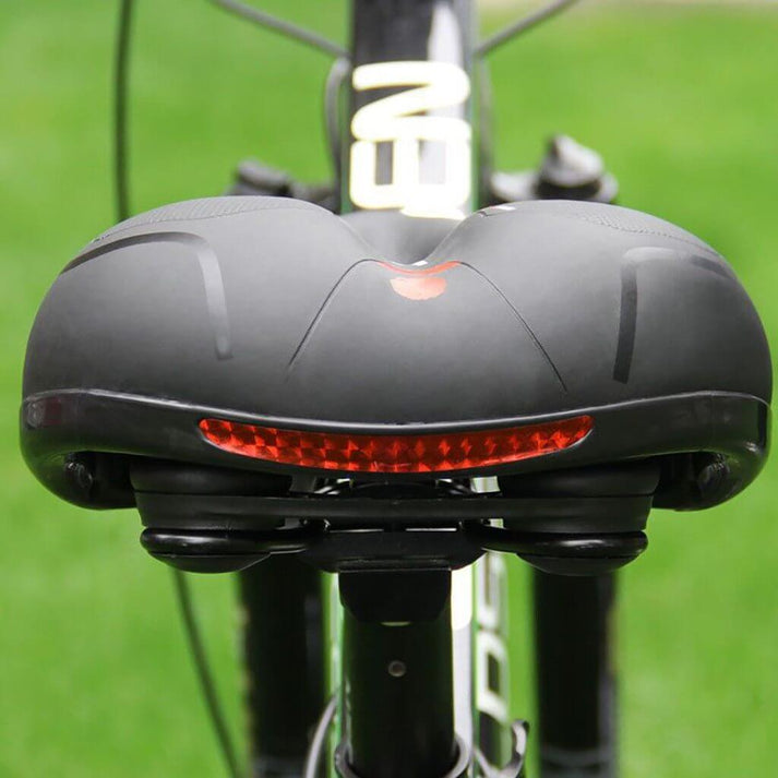 Accessoire vélo: Selle confort unisexe rouge, fluorescente, pour VTT et route, sécurité accrue.
