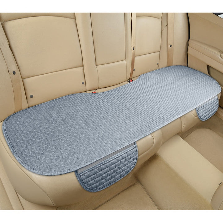 Coussin de siège universel pour voiture, antidérapant, en lin, offre protection et confort optimal.