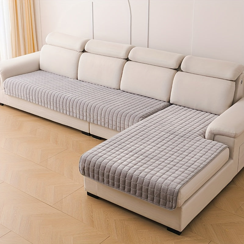 Couverture de canapé élégante matelassée anti-tache, assure confort et protection optimale du salon.