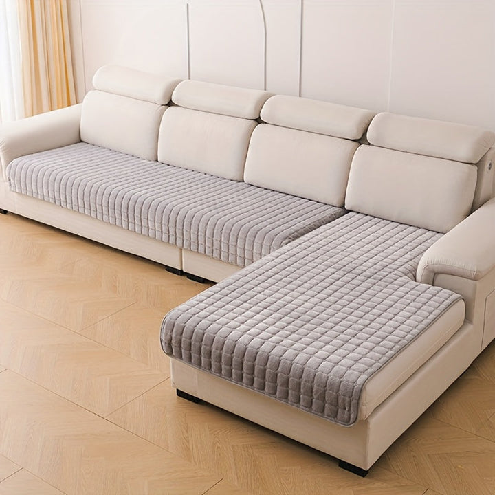 Couverture de canapé élégante matelassée anti-tache, assure confort et protection optimale du salon.