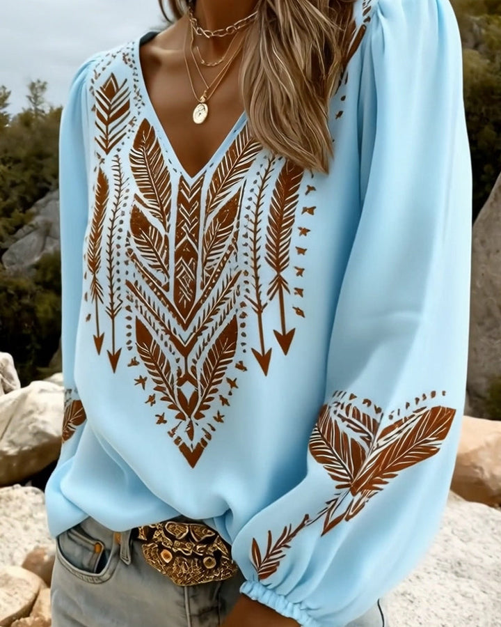 Haut femme printemps-été bohème chic. Blouse à décolleté en V, manches bouffantes et joli imprimé ethnique.
