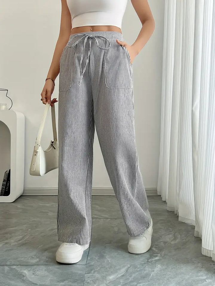 Pantalon large femme, motif rayé, classique confortable et stylé.
