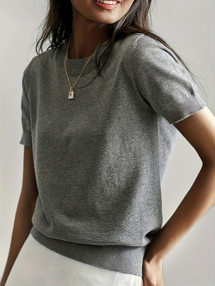 Haut pull de printemps confortable pour femme, manches courtes, look décontracté et élégant.
