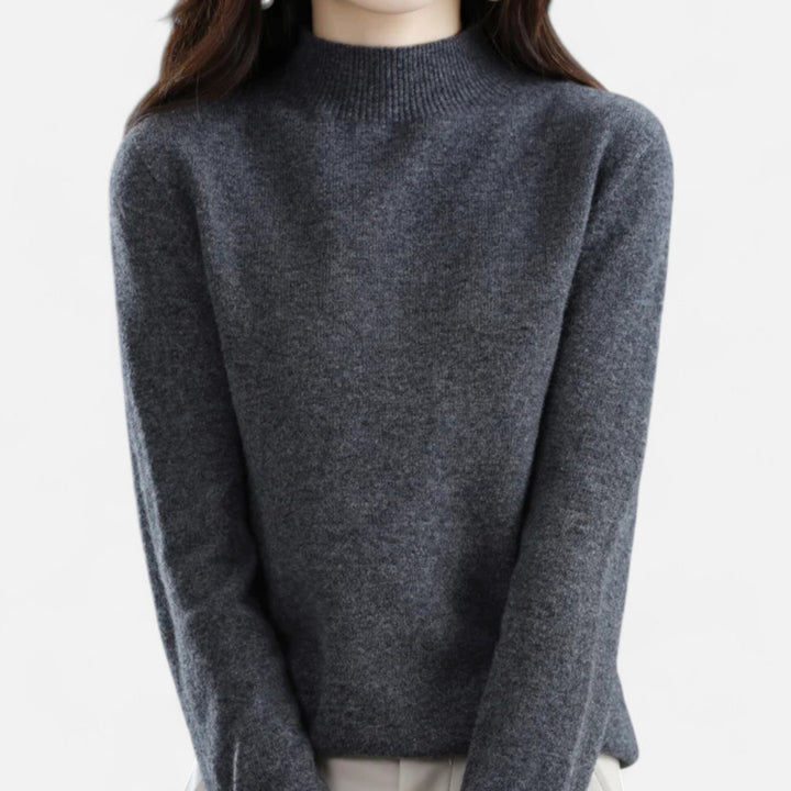 Pull col montant femme élégant, bords côte, tricot doux. Idéal hiver/automne.