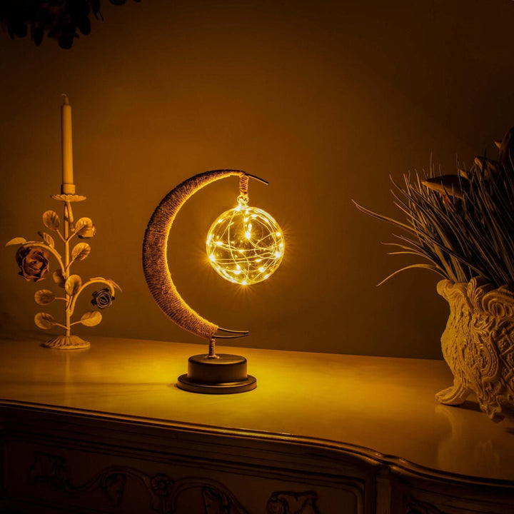 Décoration de table lune en verre borosilicaté, lampe LED au design épuré.