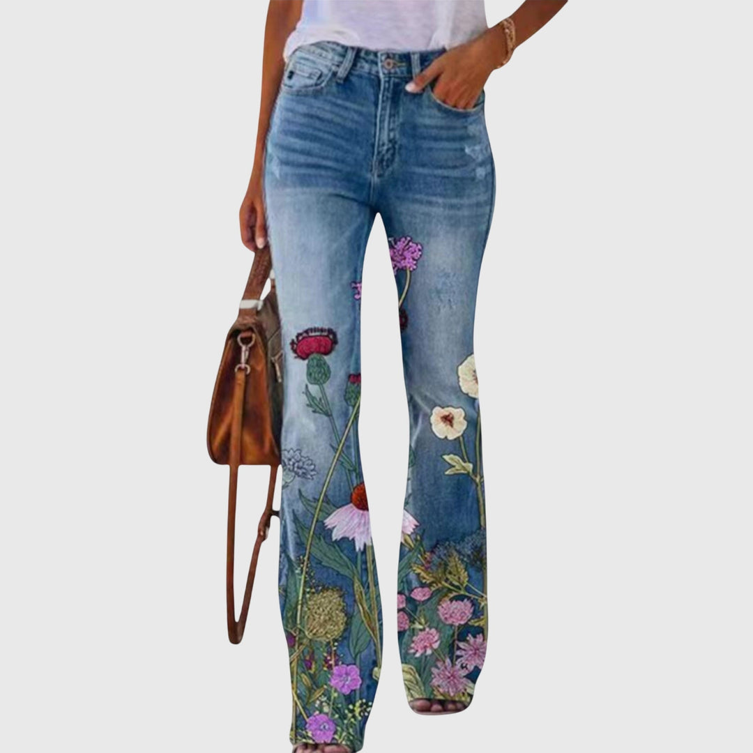Pantalon femme évasé à motif floral délicat, coupe large fluide pour un look printemps-été féminin.
