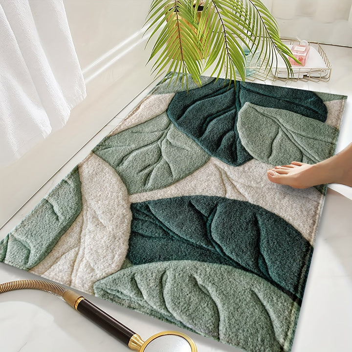 Tapis de bain vert absorbant en microfibre avec motif feuilles. Douillet et antidérapant pour salle de bain.