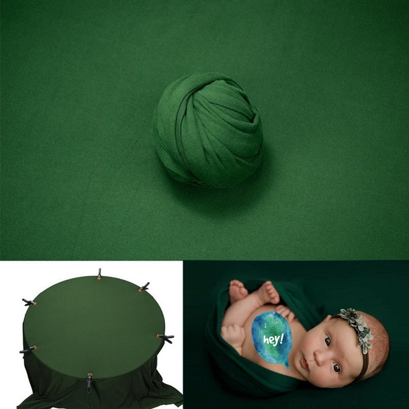 Kit photographie bébé avec couverture mousseline et toile de fond studio.