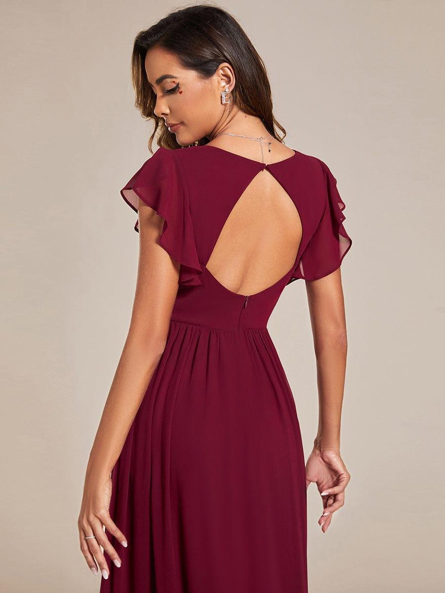 Robe longue femme, dos ouvert, coupe fluide, pour une cérémonie de mariage printanière. Style maxi.