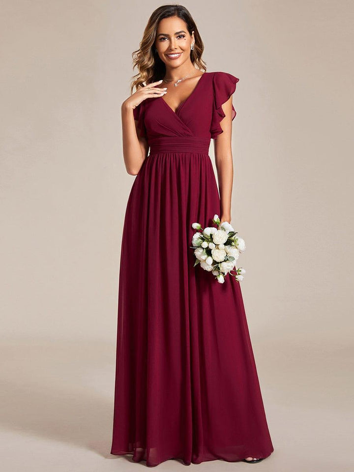 Détail du dos ouvert sur une robe de soirée chic. Idéale pour demoiselle d'honneur ou grande fête.