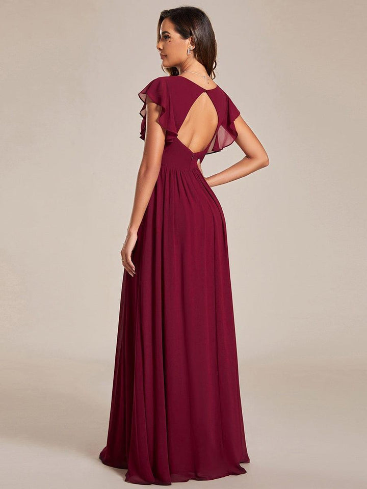 Vue arrière d'une robe maxi élégante, dos ouvert raffiné. Idéale pour cérémonie ou demoiselle d'honneur.
