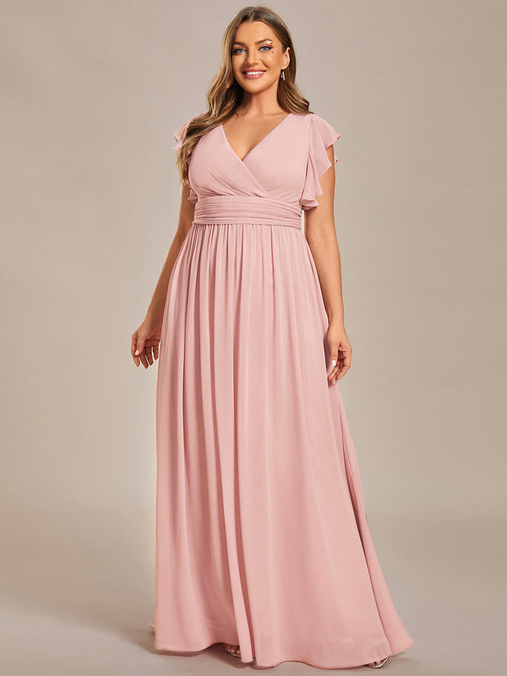 Robe de cérémonie femme, dos ouvert, col en V. Longue et fluide pour un look estival parfait et audacieux.
