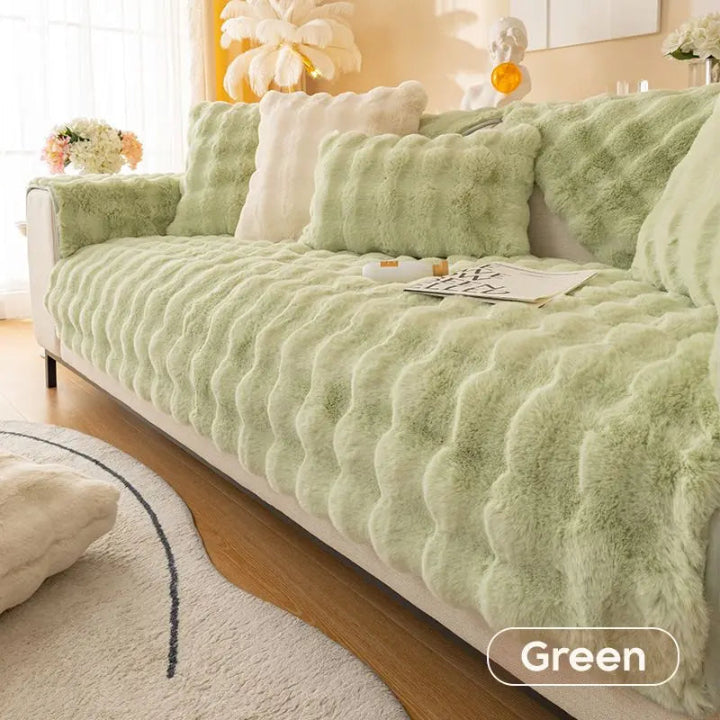 Housse de canapé élastique vert kaki pour salon, protection et décoration moderne en polyester.