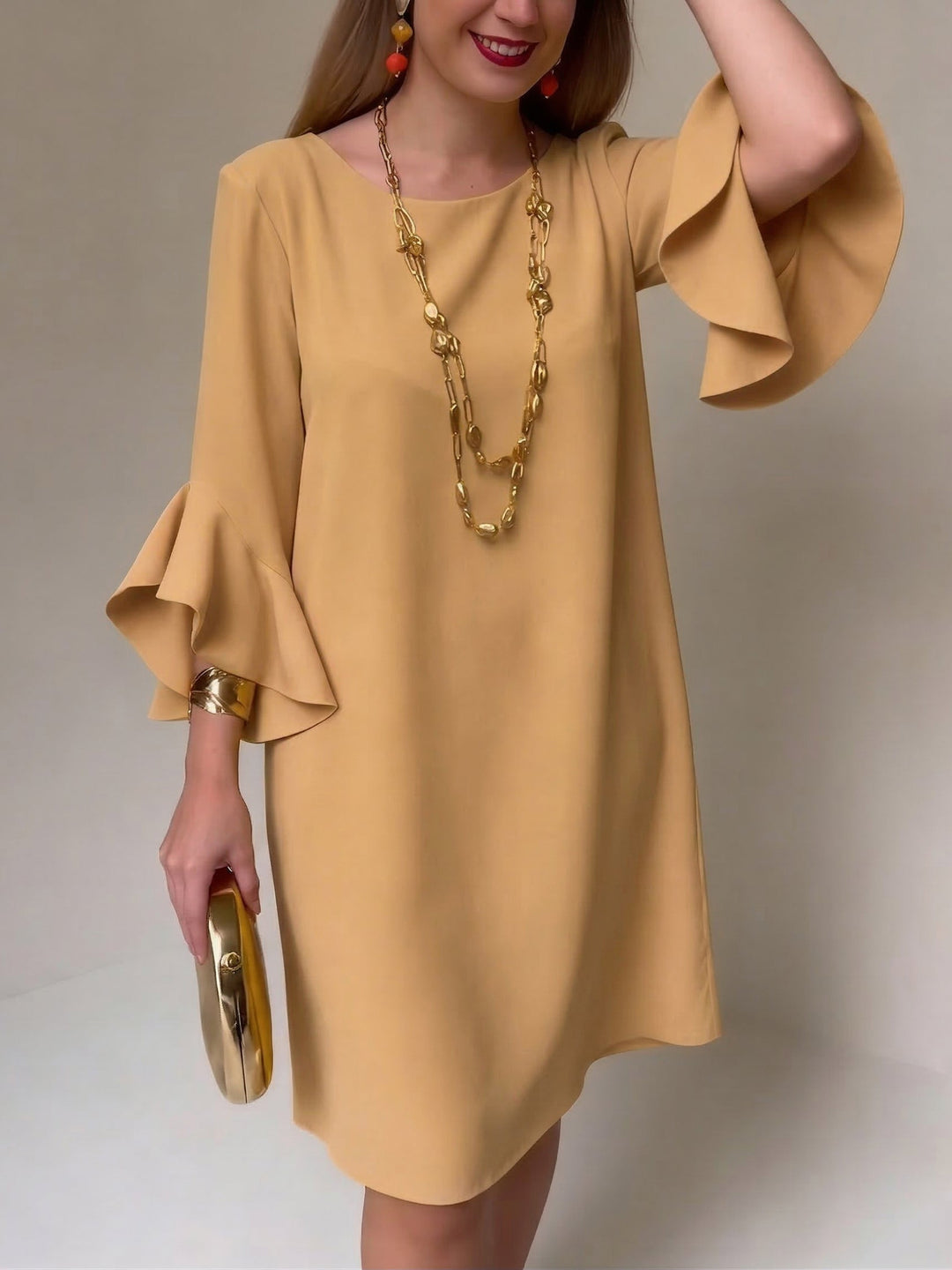 Robe femme fluide et chic, manches volantées. Idéale pour un look décontracté ou élégant au printemps/été.