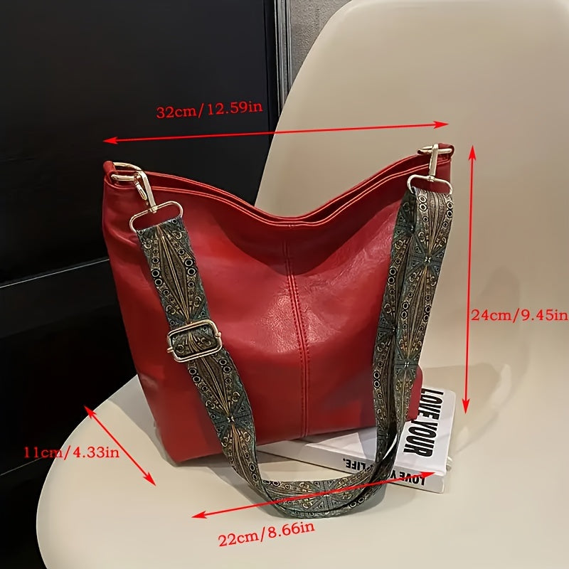 Design géométrique distinctif sur sac bandoulière rétro chic pour femme, grand et fonctionnel.