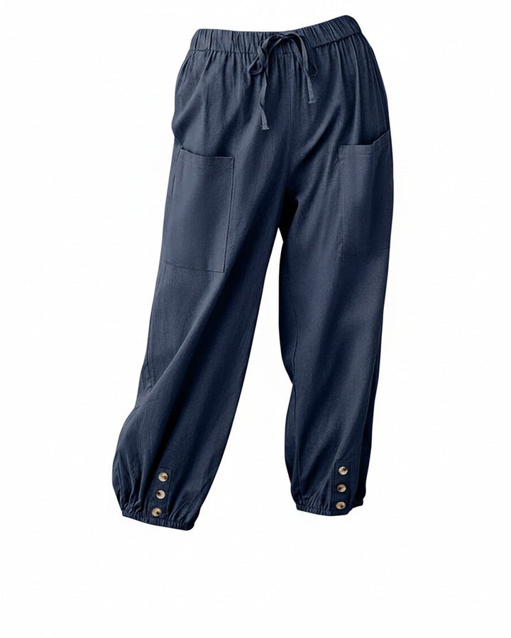 Pantalon sarouel femme décontracté, taille élastique et boutons stylés. Confortable et chic pour l'été.