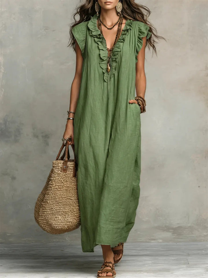 Robe maxi femme style bohème, avec col V, volants et poches, pour une élégance estivale tendance et confortable.