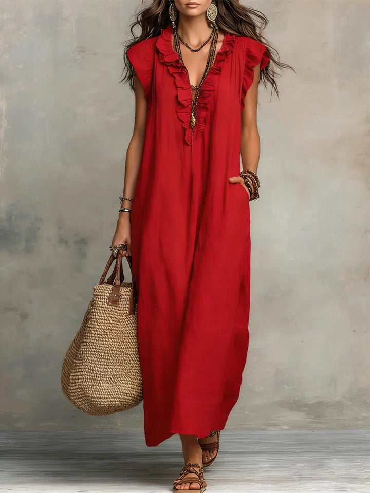 Robe maxi bohème fluide pour femme, col V, volants, idéale pour une élégance estivale aérienne et confortable.